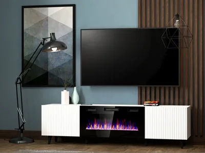A modern living room setup featuring a TV stand with a built-in fireplace, a large television, and a floor lamp.