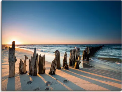 Produktbild von ARTland Leinwandbild Sonnenuntergang Strand Wellenbrecher Größe: 120x90 cm
