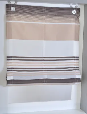 A Roman blind with horizontal stripes in various shades of brown, beige, and white, hanging in a window frame.