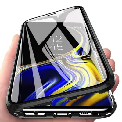 A hand holding a smartphone in a protective case.