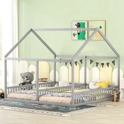 A children's bedroom with a grey house-shaped bed frame, two mattresses, and stuffed animals.
