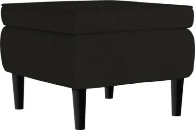 A black velvet ottoman with wooden legs is shown against a white background.