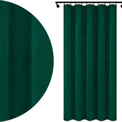 A close-up view of a dark green velour curtain and a full view of a dark green curtain hanging from a rod.