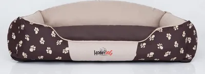 A dog bed with a paw print pattern.