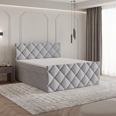 A bedroom setting with a bed as the main focus.