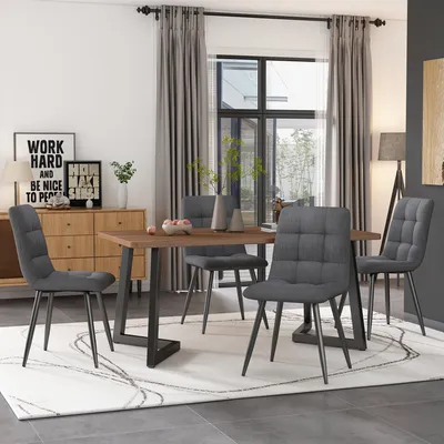 A dining room scene with a table and chairs.