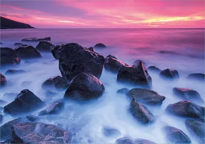 Produktbild von Wallario Poster - Felsen im Meer bei Sonnenuntergang, Kunstdruck Größe: 70 x 100 cm