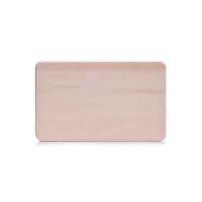 A top-down view of a light-colored wooden cutting board with rounded corners, set against a pure white background.