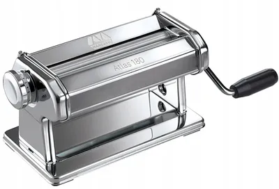 A shiny chrome pasta maker with a black handle and a white knob is shown from a slight diagonal angle.