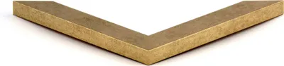 A corner of a picture frame with a vintage gold finish.