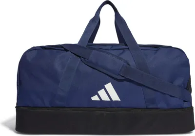 A studio shot of a blue and black Adidas duffel bag.