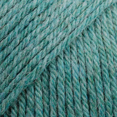 A close-up, detailed view of teal-colored yarn.