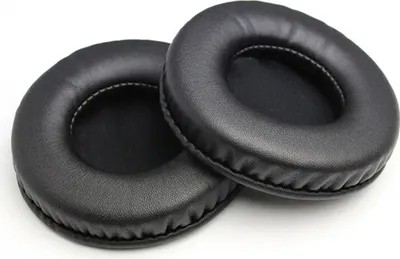 Two black leather ear pads for headphones are shown on a white background.