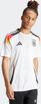 A young man wearing a white soccer jersey with German flag colors on the shoulders.
