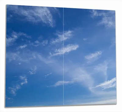 Produktbild von Wallario Herdabdeckplatte aus Glas, Größe 60 x 52 cm 2-teilig, Motiv Blauer Himmel mit vereinzelten Wolken