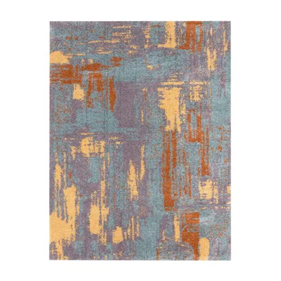 A close-up, abstract patterned rug.