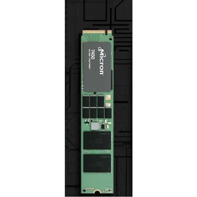 A close-up, top-down view of a Micron 7450 PRO M.2 NVMe SSD on a black textured background.
