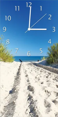 Produktbild von Wallario Design Wanduhr Auf dem Sandweg zum Strand - Blauer Himmel über dem Meer aus Echtglas, Größe 30 x 60 cm