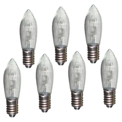 A group of seven clear LED light bulbs with ribbed glass and silver bases are arranged on a white background.