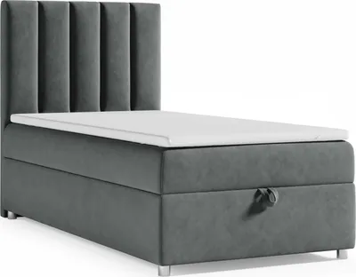 A studio shot of a single bed with a headboard and a mattress topper.