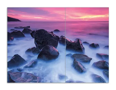 Produktbild von Wallario Herdabdeckplatte aus Glas, Größe 70 x 52 cm 2-teilig, Motiv Felsen im Meer bei Sonnenuntergang