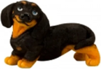 Dackel aus Polyresin. Der Hund ist schwarz mit hellbraunen Pfoten und Brust Augen sind groß und blau