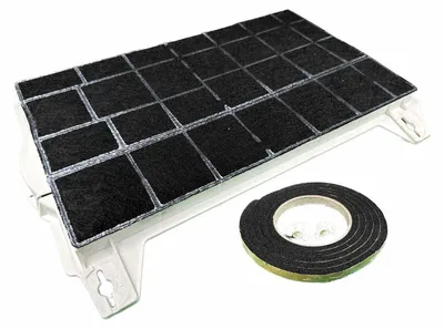 A carbon filter and a roll of double-sided tape are shown on a white background.