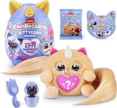 A collection of Rainbocorns Kittycorn Surprise toys, including a large egg, a plush toy, and smaller accessories.