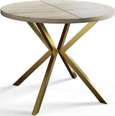 A round dining table with a light wood top and a gold metal base, shown from a slightly elevated angle against a white background.
