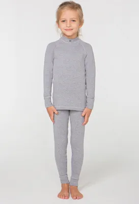 A young girl is standing and posing for a product photo, wearing a grey thermal underwear set.