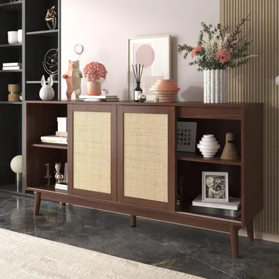 A wooden sideboard with rattan doors, decorated with various items, in a room setting.