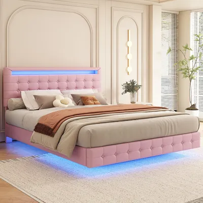 A pink upholstered bed with LED lighting in a bedroom setting.