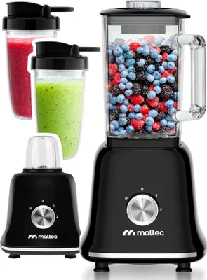 A product shot of a black stand mixer with a glass blender jar filled with berries, two smoothie cups, and a smaller grinder attachment.