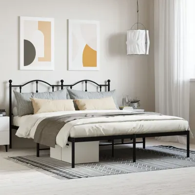 A bedroom scene with a black metal bed frame, bedding, two framed abstract art pieces, and a pendant lamp.
