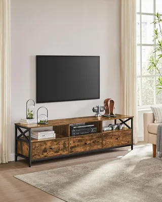 A living room with a TV stand and TV.
