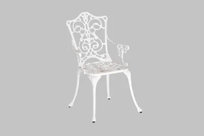A white ornate garden chair is shown against a plain gray background.