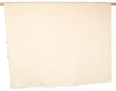 A cream-colored blanket with a herringbone pattern is displayed flat against a white background.