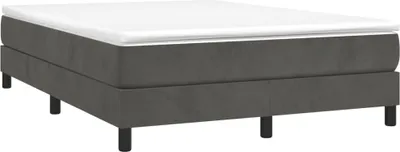 A dark gray boxspring bed frame with a white mattress topper, shown from a side angle on a white background.