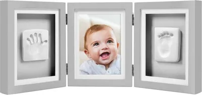 A triptych photo frame with a baby's photo in the center and handprints on either side.