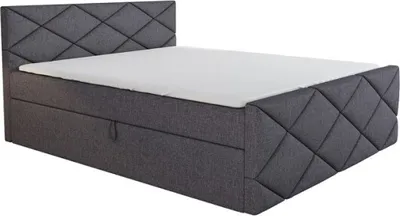 A studio shot of a boxspring bed.