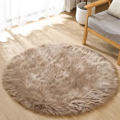 Zdjęcie produktu dla Okrągły, beżowy dywan shaggy o średnicy 120 cm, idealny do salonu