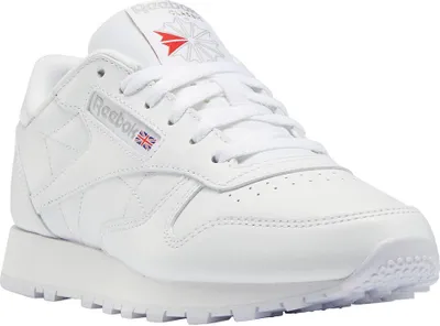 A white Reebok sneaker is shown from a slightly elevated side angle against a white background.
