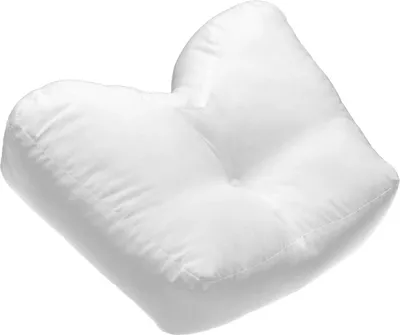A white pillow with a unique shape, presented against a white background.