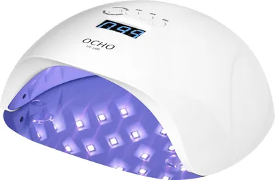 A white UV LED nail lamp with its lights on, showing the interior LEDs.