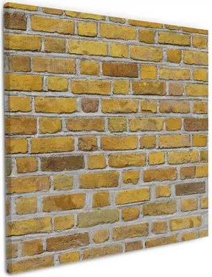 Produktbild von Wallario Premium Leinwandbild Ziegelsteinwand in gelb - Backsteine in Größe 50 x 50 cm