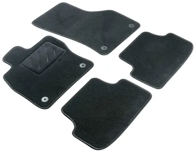 A set of four car floor mats arranged on a white background.