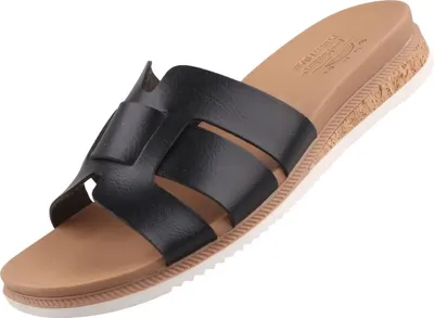 Auf dem Bild ist eine schwarze Sandale zu sehen die von der Seite aufgenommen wurde. Die Sandale hat ein modernes Design mit breiten Riemen und einer flachen Sohle.