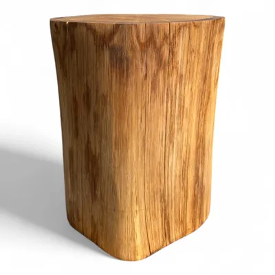 A solid wooden stump used as a table or decorative stand, shown against a white background.