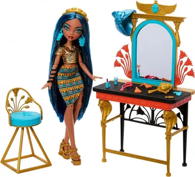 A Monster High doll with a vanity and chair set, presented against a white background.