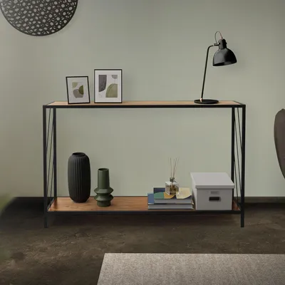 A console table with decorative items on it, placed in a room.